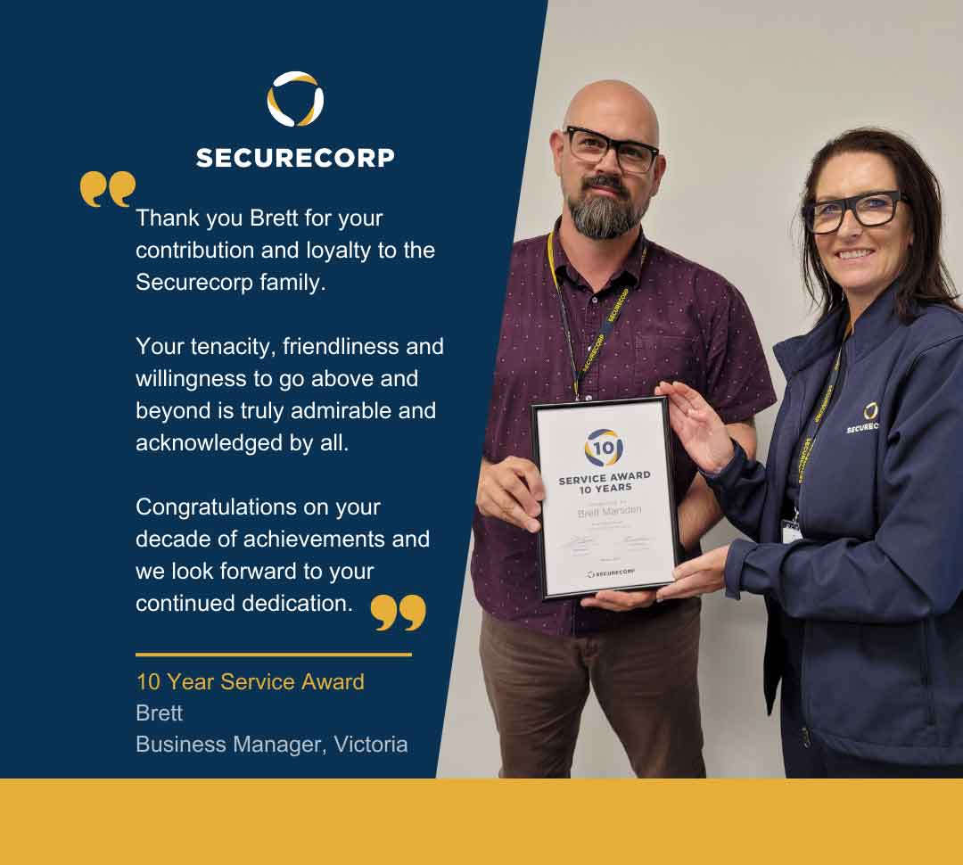 Brett receiving 10 year service award at Securecorp